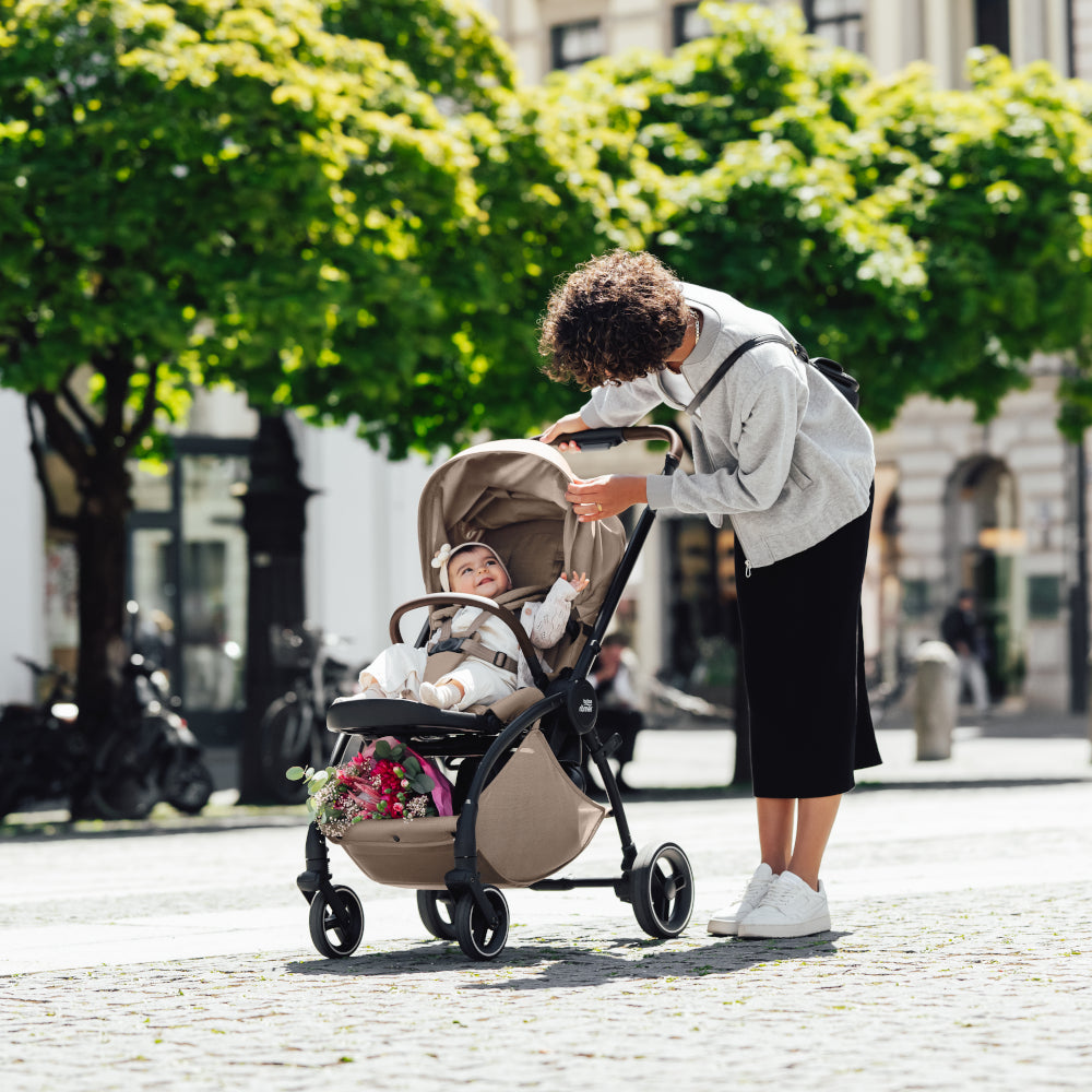 Britax Rio Travel System Stroller Teak, mother with baby