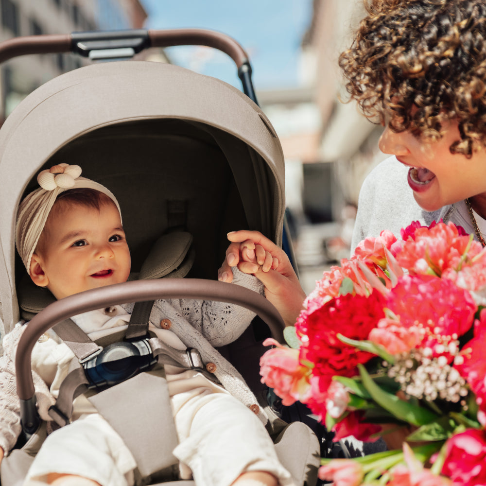 Britax Rio Travel System Stroller Teak, mother with baby