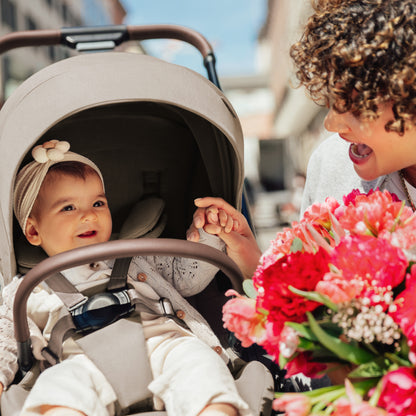 Britax Rio Travel System Stroller Teak, mother with baby