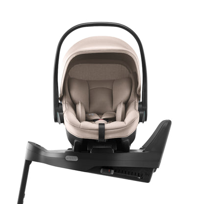 Britax Römer Baby-Safe Core infant carrier car seat in chai beige, on Vario ISOfix base
