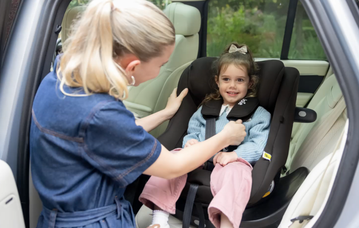 Mum and daughterin Joie i-Pivot swivel car seat facing the car door