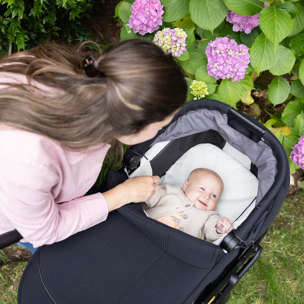 Mum with Baby in Joie Finiti Pushchair with Ramble XL Carrycot Black